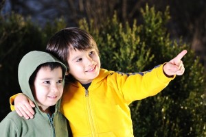 Children outside pointing